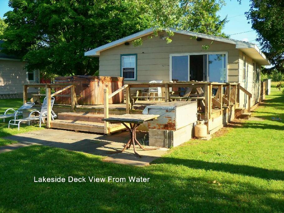 The back deck including the hot tub (left) and large gas grill(right front).