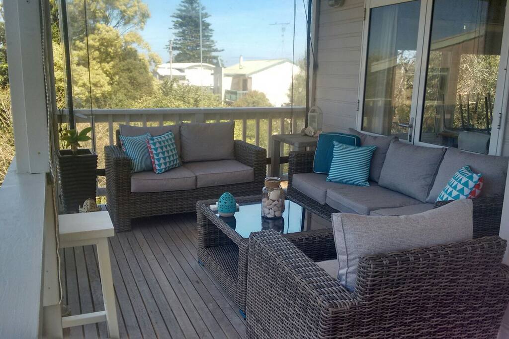 upstairs outdoor lounge area, 3 cafe blinds installed