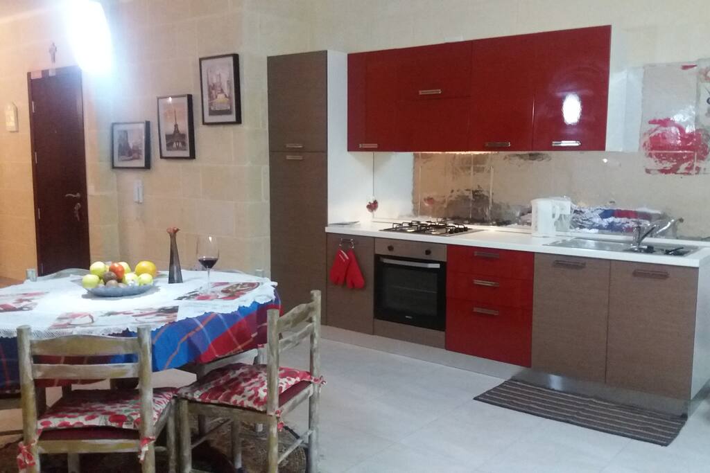 The Kitchen is spacious and equipped with appliances.