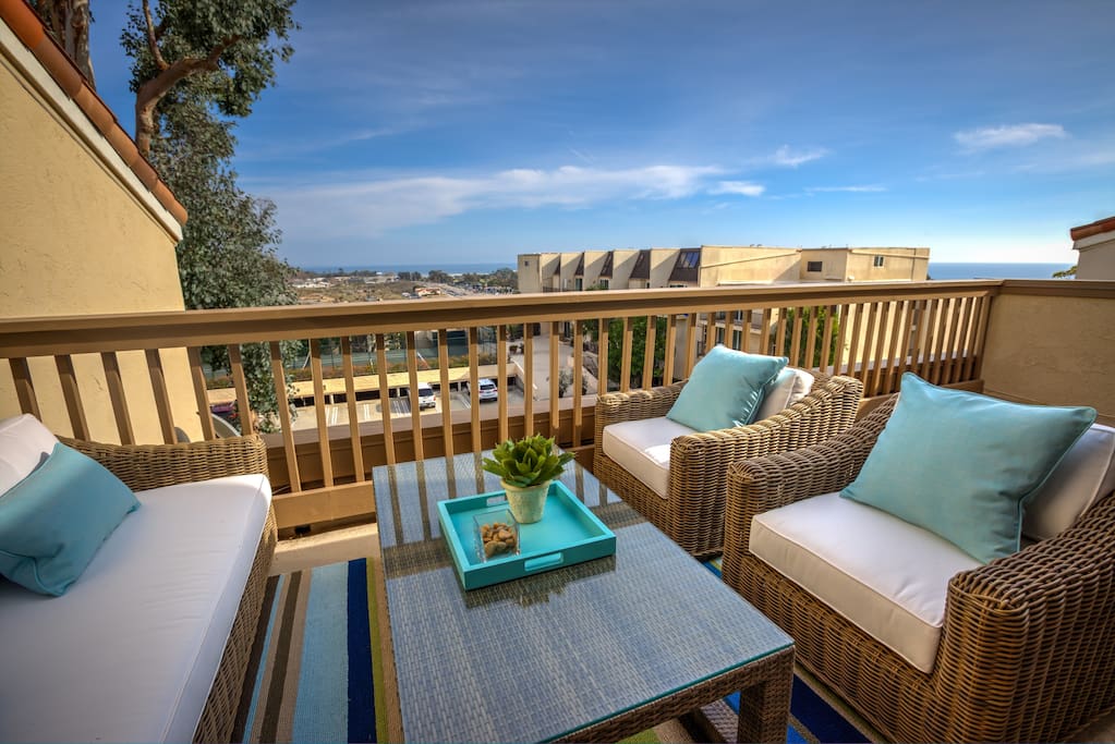 Comfortable outdoor seating on the patio with gorgeous ocean views