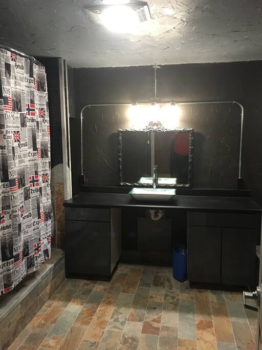 Cavernous tri level bathroom.