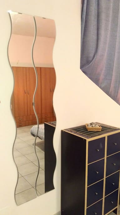 the mirror near the bed