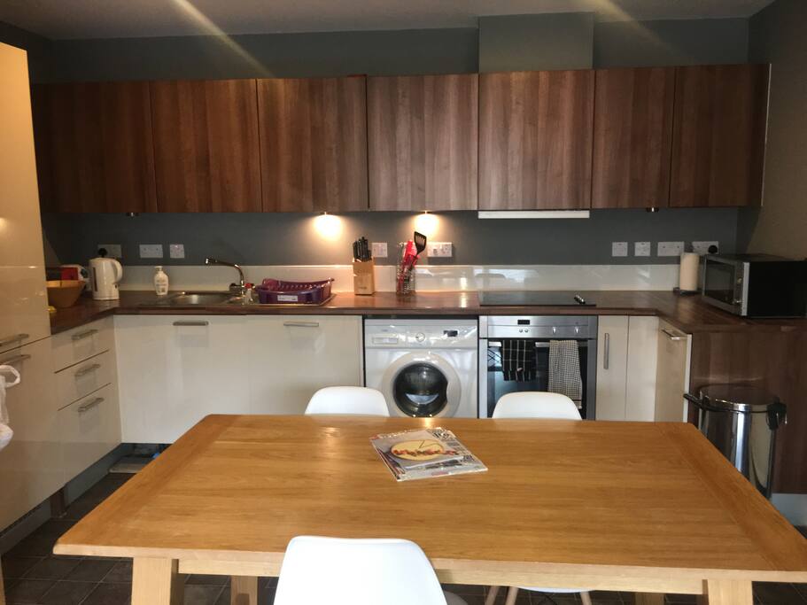 Open plan kitchen with all cooking utensils microwave, large fridge and freezer, washing machine (with two clothes rails to dry your clothes)