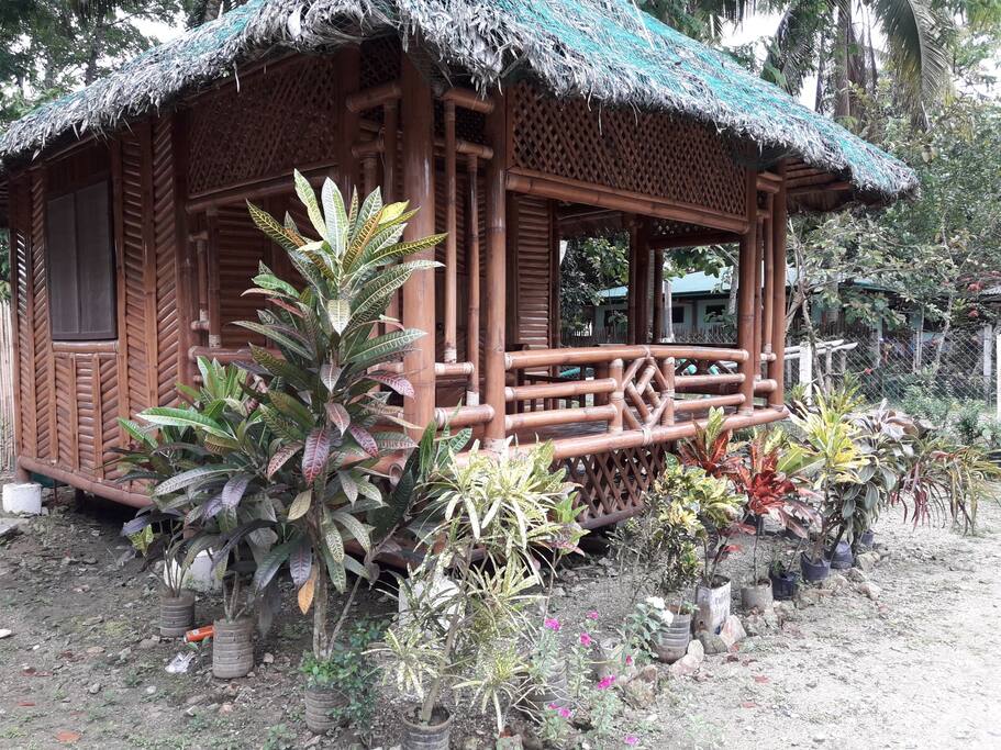 the bamboo hut with the balcony outside the room