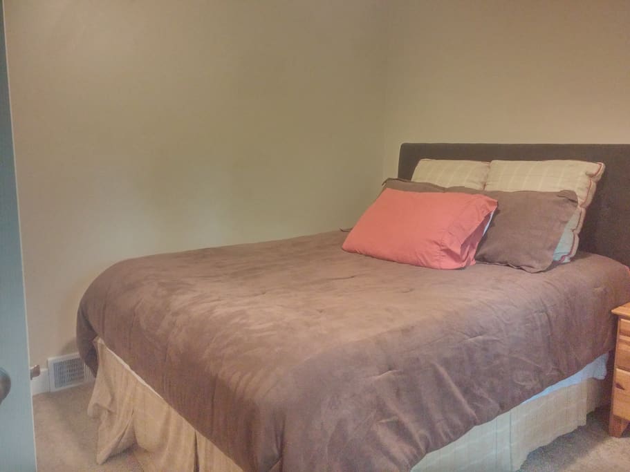1 of 2 spare rooms available with private entrance. Room overlooks woods and offers closet space, nightstand, and dresser