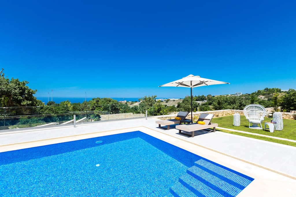 Swimming pool area with panoramic sea view