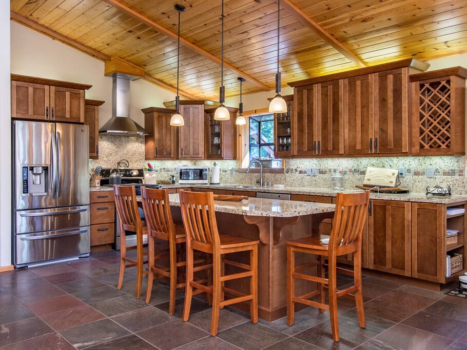 Greet the day with a cup of coffee at the granite kitchen bar with seats for 4.