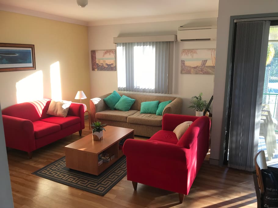 Sunny living. Double sofa bed in lounge for 5th guest. Overlooks pool and tennis court. Air conditioned.
