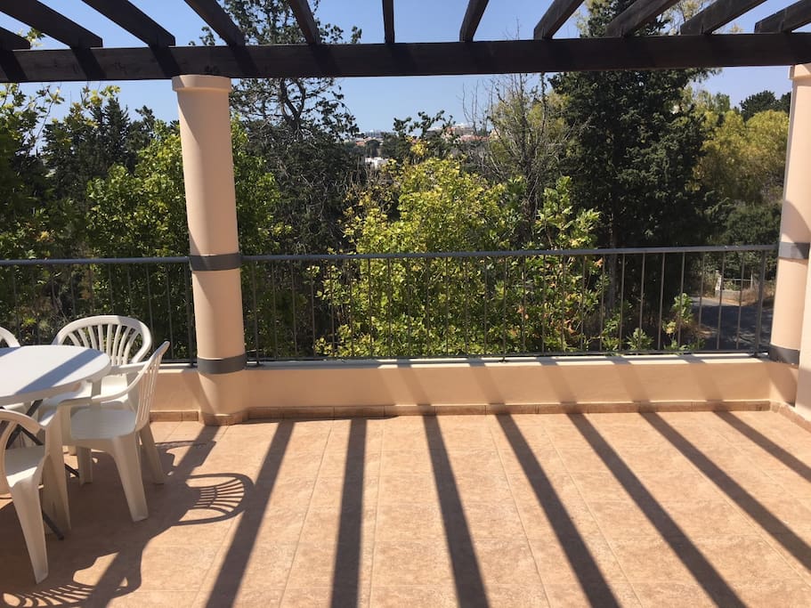 Spacious outdoor balcony ideal for morning breakfast and evening drinks.