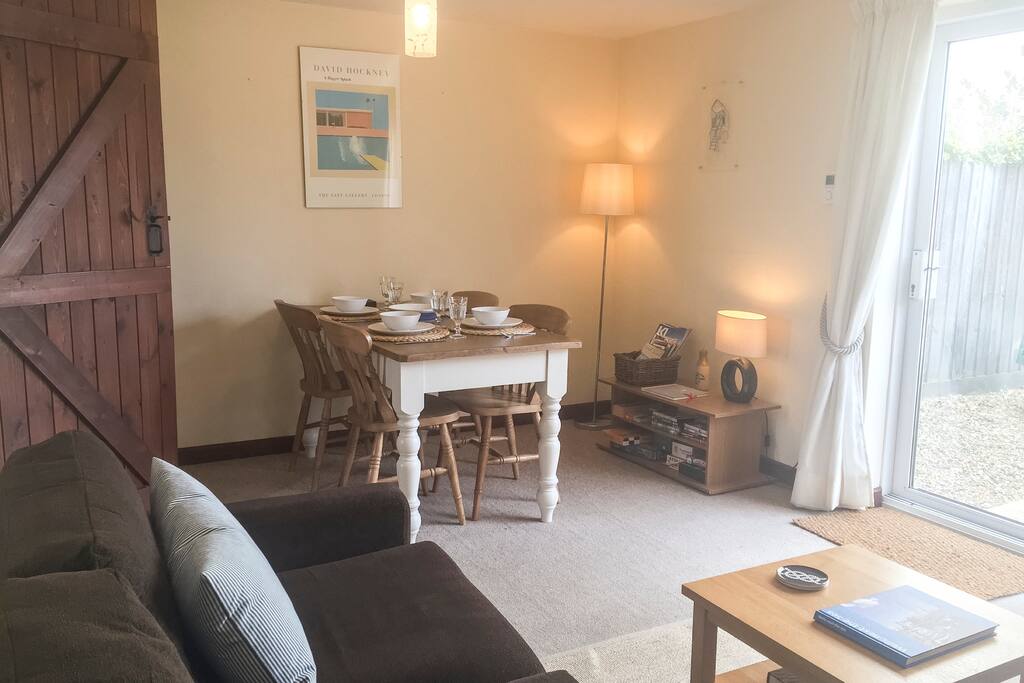 Open plan living room with dining table