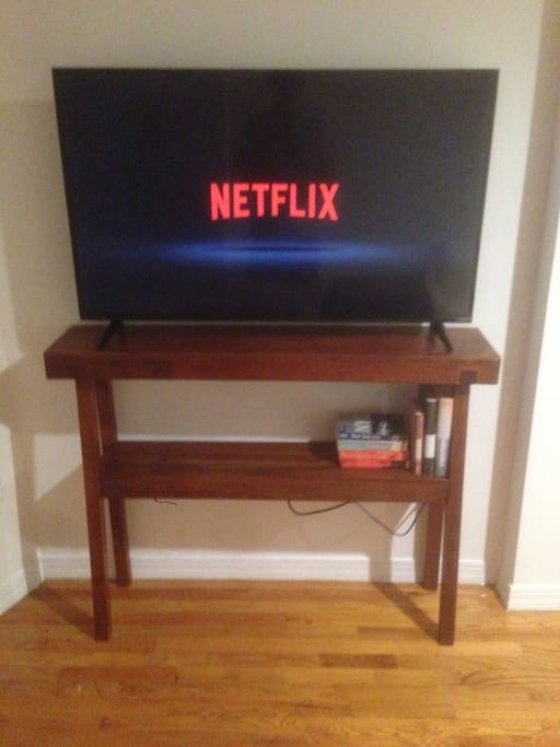 48" flatscreen smart TV and premium cable channels.