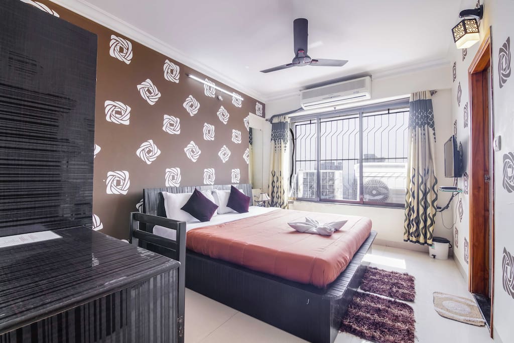 Spacious Master Bedroom with AC, LED TV, Wardrobe, Study Table and attached Western Style Washroom with separate wet/dry areas