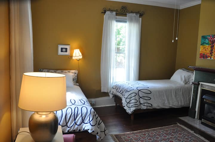 Yellow Room - 2 Twin XL's perfect for adults as well as children. Large private Bathroom with historic clawfoot tub/shower