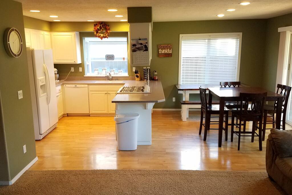 Open kitchen and dining room right off the living room creating a perfect entertainment area. Dining room has 2 tables for multiple seating arrangements.