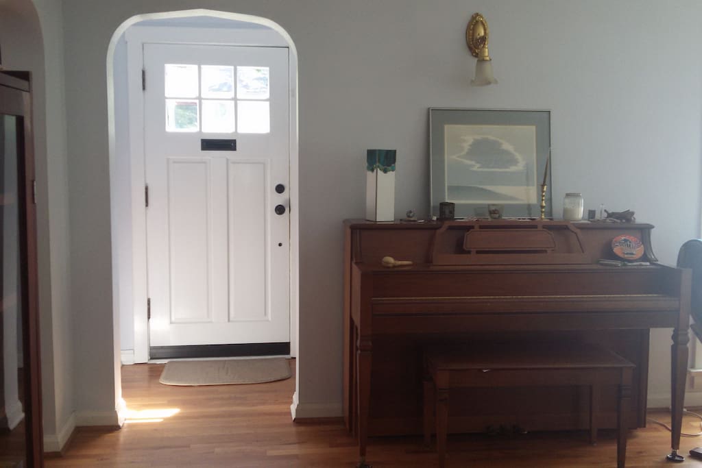 Entry Way showing the piano in the Living Area