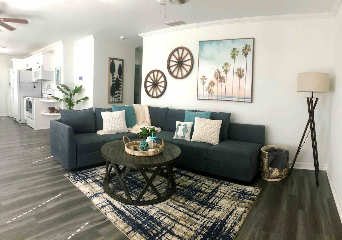Living area, modular couch turns into a bed. 