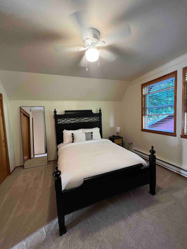 Bedroom 2 with 1 queen bed and a work space 