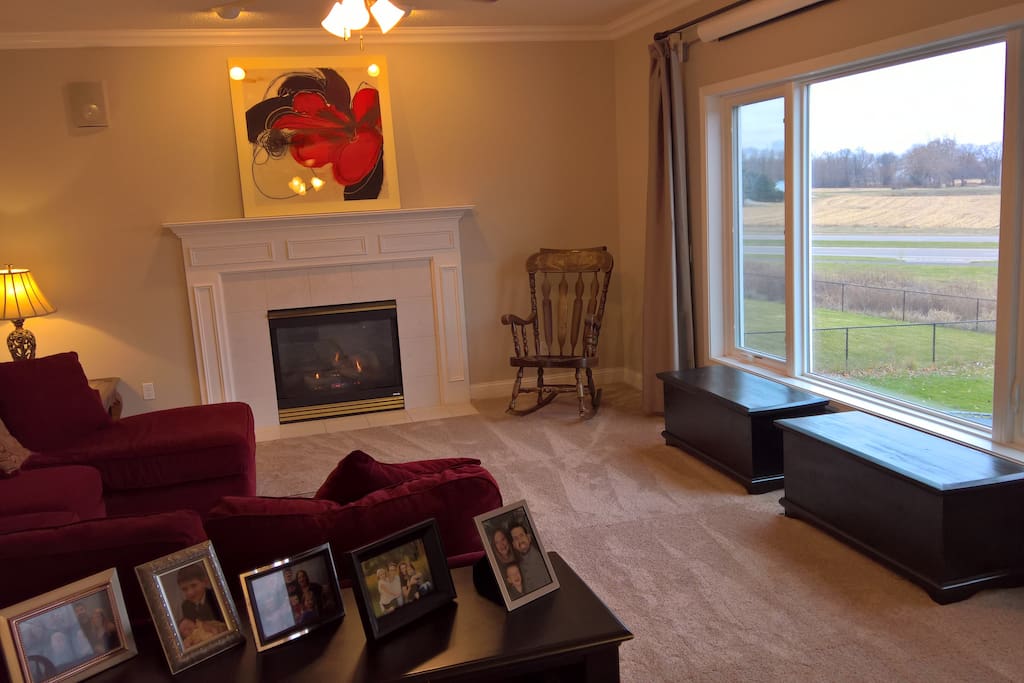 Comfortable main floor family room with gas fireplace doubles as a home theater.