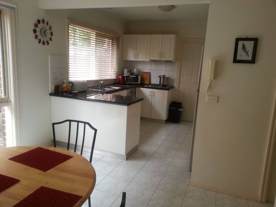 Modern open kitchen and dining area. Opens to a cute courtyard with BBQ. Has dishwasher, microwave, wall over and large fridge. Coffee machine! Rice Cooker!