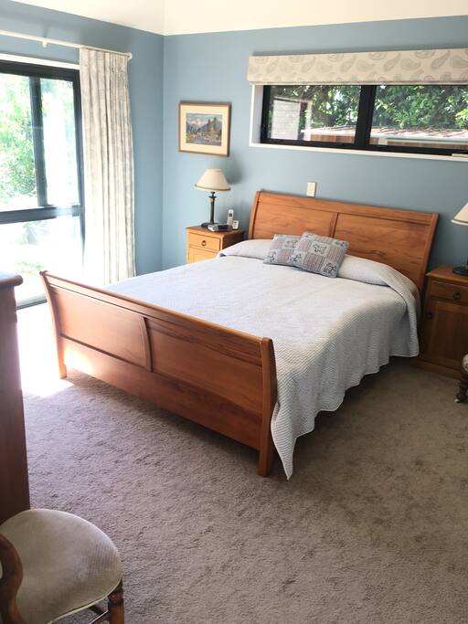Master bedroom with ensuite and doors into garden