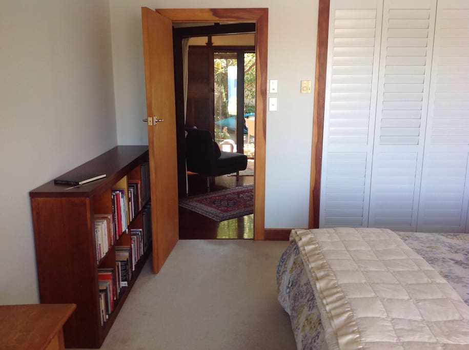 Guest bedroom looking through to lounge and rear deck.