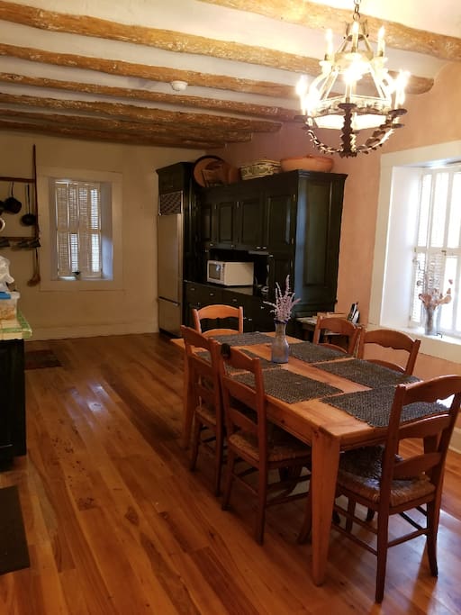 Huge kitchen and dining room with basic cooking supplies and utensils
