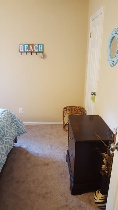 The room available has a luggage rack, oversized nightstand for clothing storage as well as easy to access outlets for convenience.