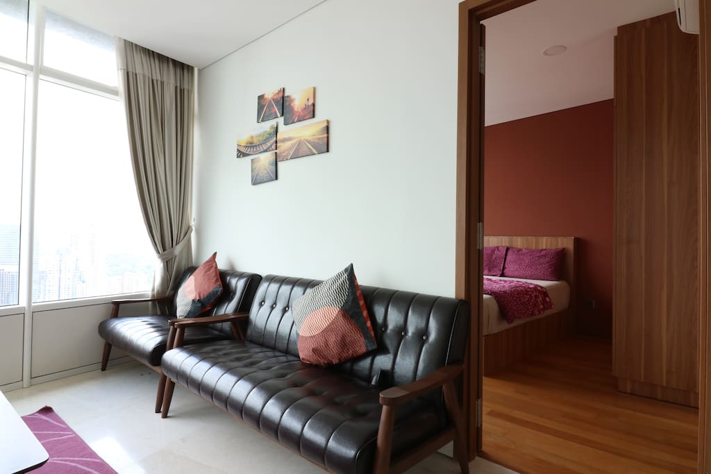 Vintage leather couch for guests to gather around the living room for a chat.