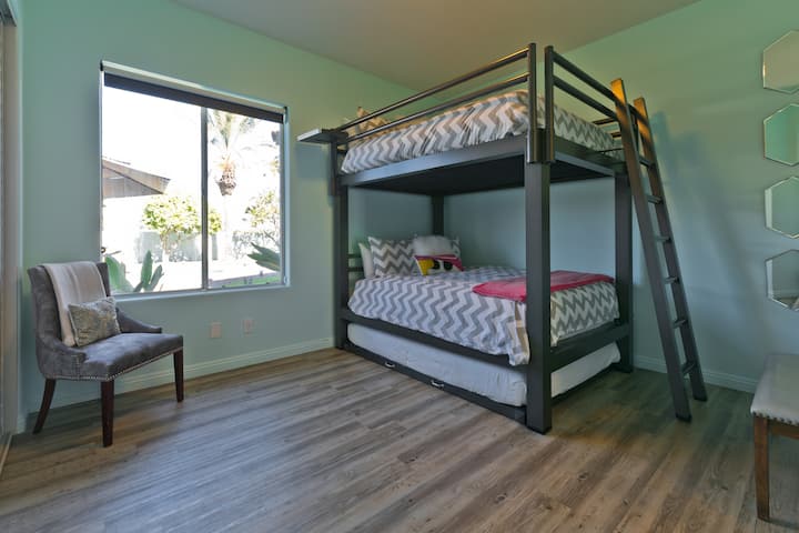 (Bedroom #2) Secondary bedroom with queen bunk beds and queen pull-out queen trundle.