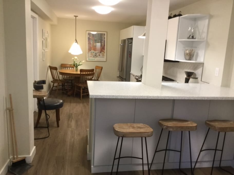 Fully furnished kitchen with extra seating at the bar.