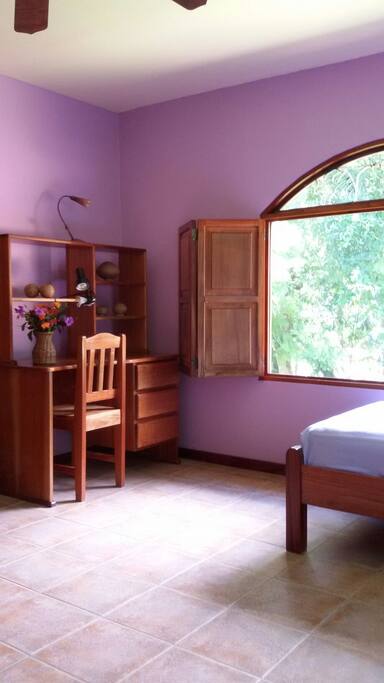 Room has large closet and desk for writing.