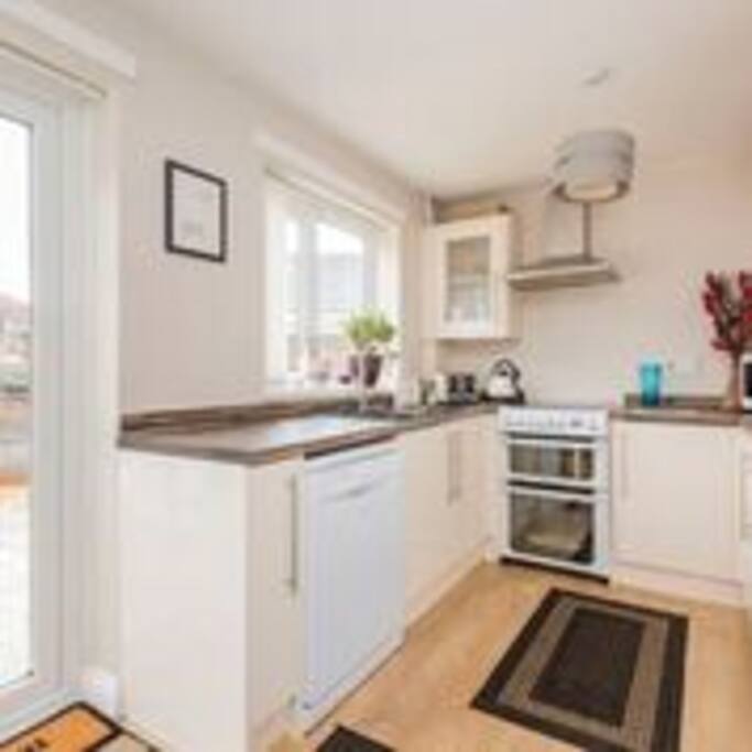 Kitchen leading to garden and patio