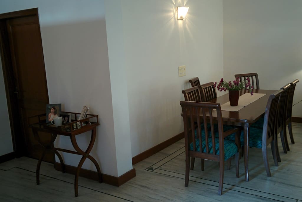 The entrance to the apartment and the dining area