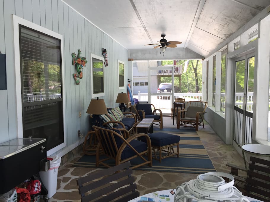 Huge screen porch with dining table and lounge seating! Inclement weather, no problem, bring all the board games onto the porch!!