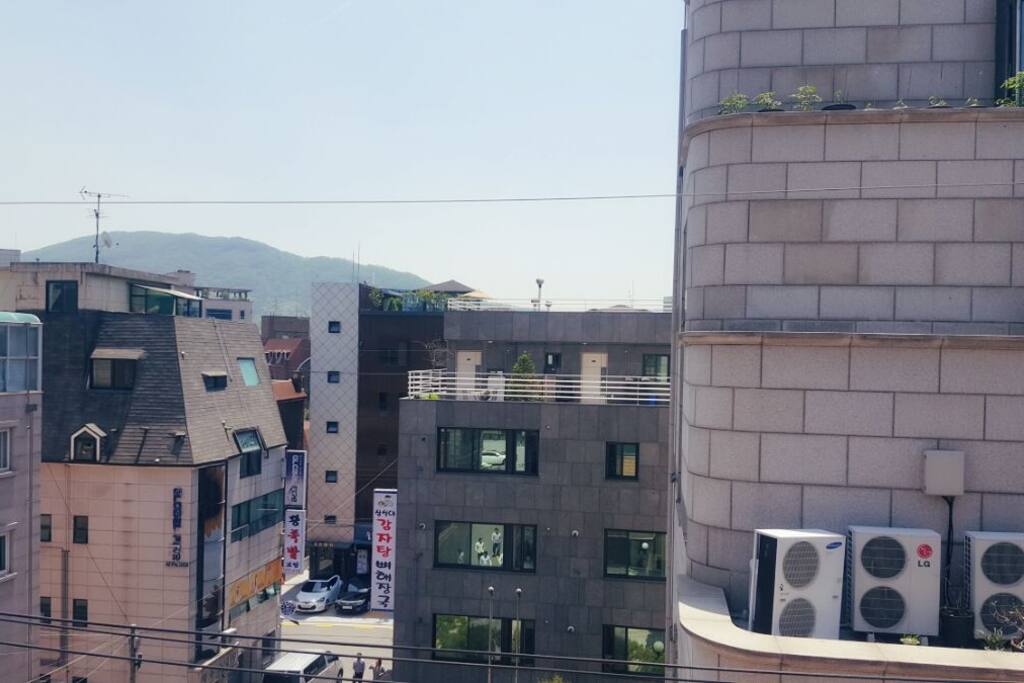 This room is located on top of the building. So good to enjoy the view from a door.