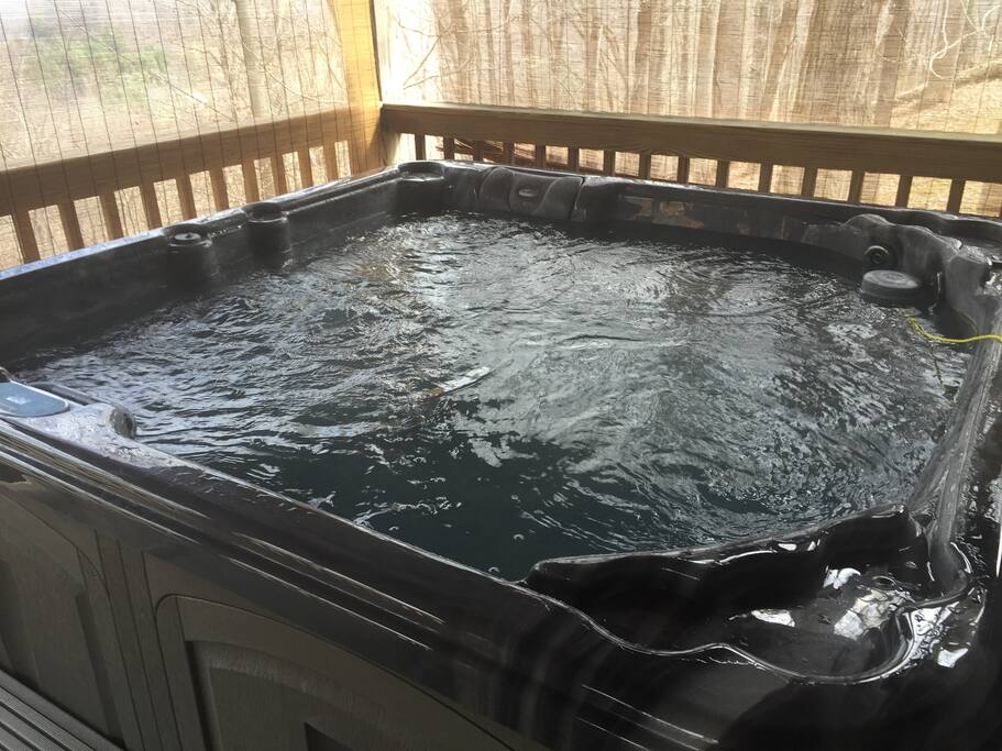 Relax in the hot tub on the back porch