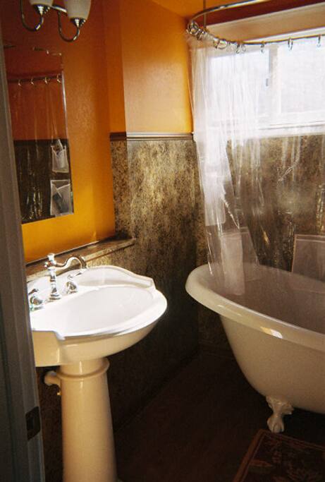 Private bath with claw foot tub.