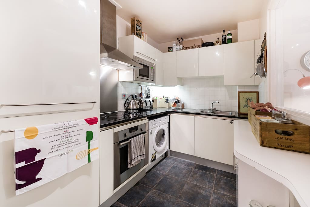 Kitchen with all amenities including oven, microwave, kettle, toaster, washer/dryer and dishwasher