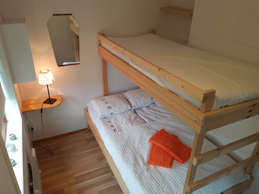 A cosy bedroom with a bunker for 3 persons. 1 double bed and 1 single bed. A made up bed like this and towels are included in your stay.