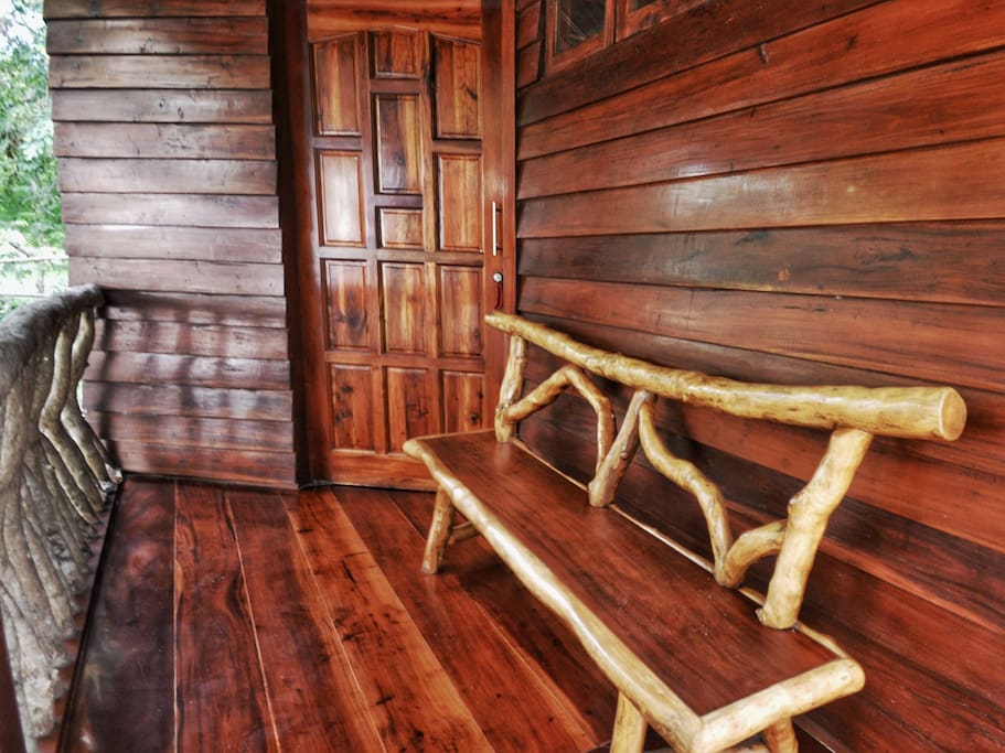 Entrance with bamboo bench, exterior massive mahagony wood