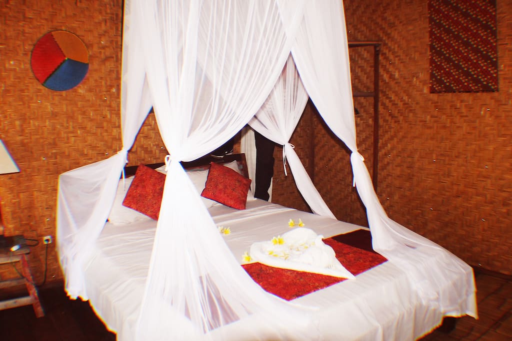 a classic room with a very traditional bamboo stail making room equipped with ac, wifi, warm water, and double bed, perfect for those of you who long for a rustic atmosphere with modern facilities