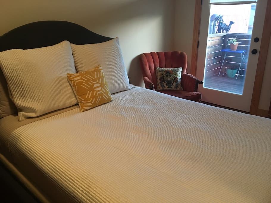 Comfy queen bed, room opens to balcony, with redi shades help block morning light.
