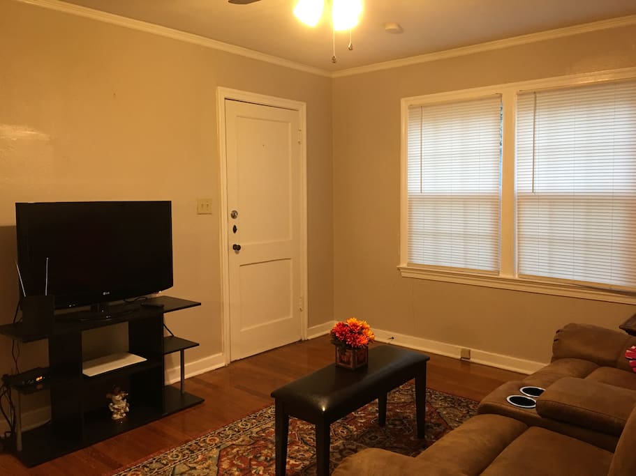 Cozy living room with cable tv and recliners.
