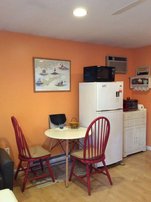 Kitchen area- equipped with a refrigerator, microwave, broiler oven/coffee pot and various kitchen supplies.