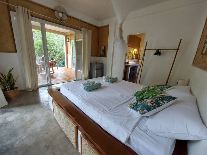 Bedroom and entrance to the bathroom