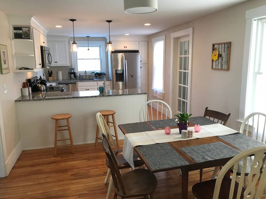 Open kitchen and dining area seats eight