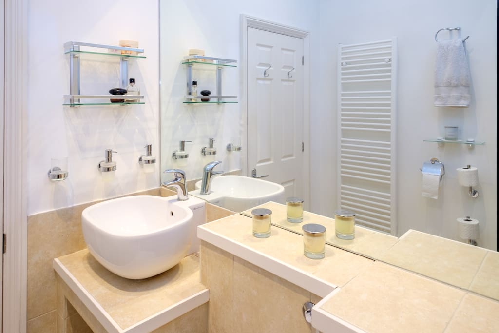 The bathroom is well stocked with toiletries
