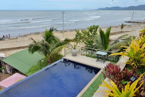 Modern beachfront apartment with infinity pool.