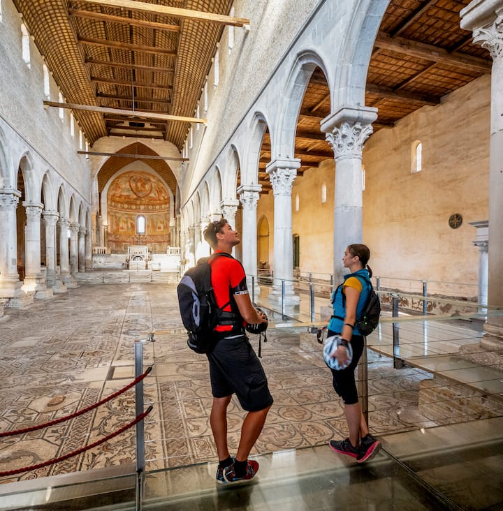 photo of two people looking into a historic site
