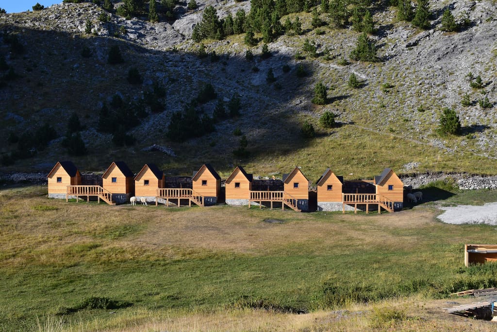 Beautiful wooden guesthouses surrounded by an amphitheatre of mountains.